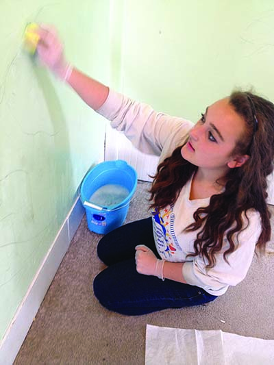 Katie Gigliotti fixing up Louison House.