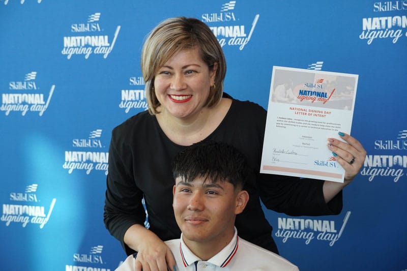 Photo of mother and son at Hobbs High School SkillsUSA Signing Day Event