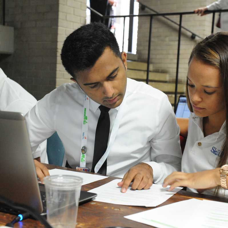 Photo of students at a computer