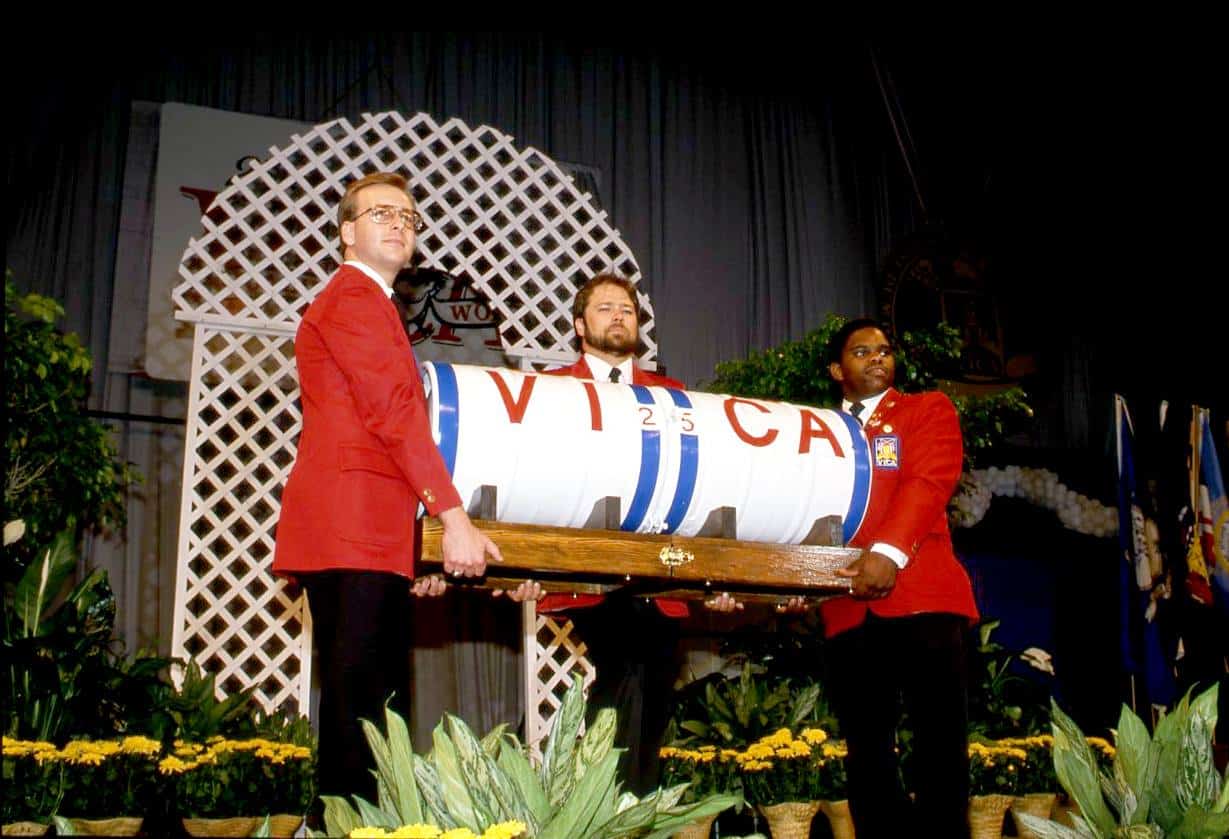 Three men holding the VICA 25th Anniversary Time Capsule}
