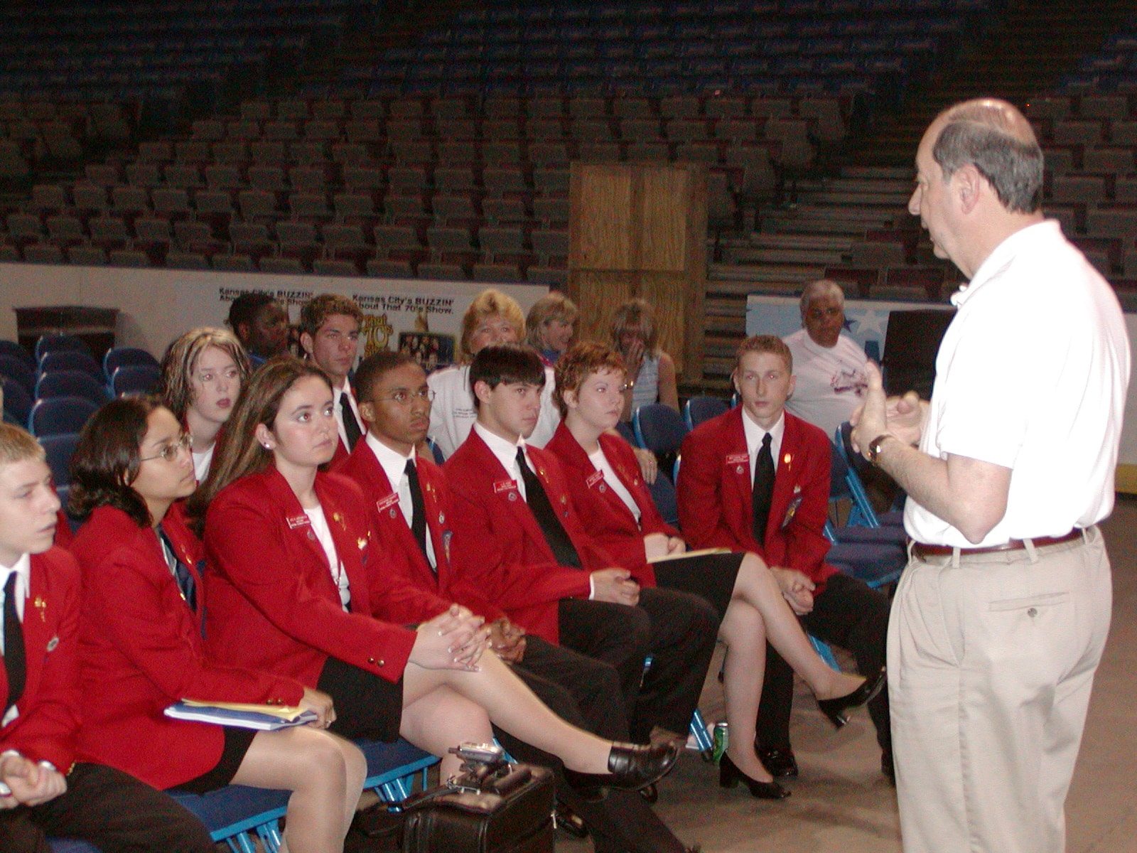 SkillsUSA staff member Michael Regauld speaks to a national officer team.}