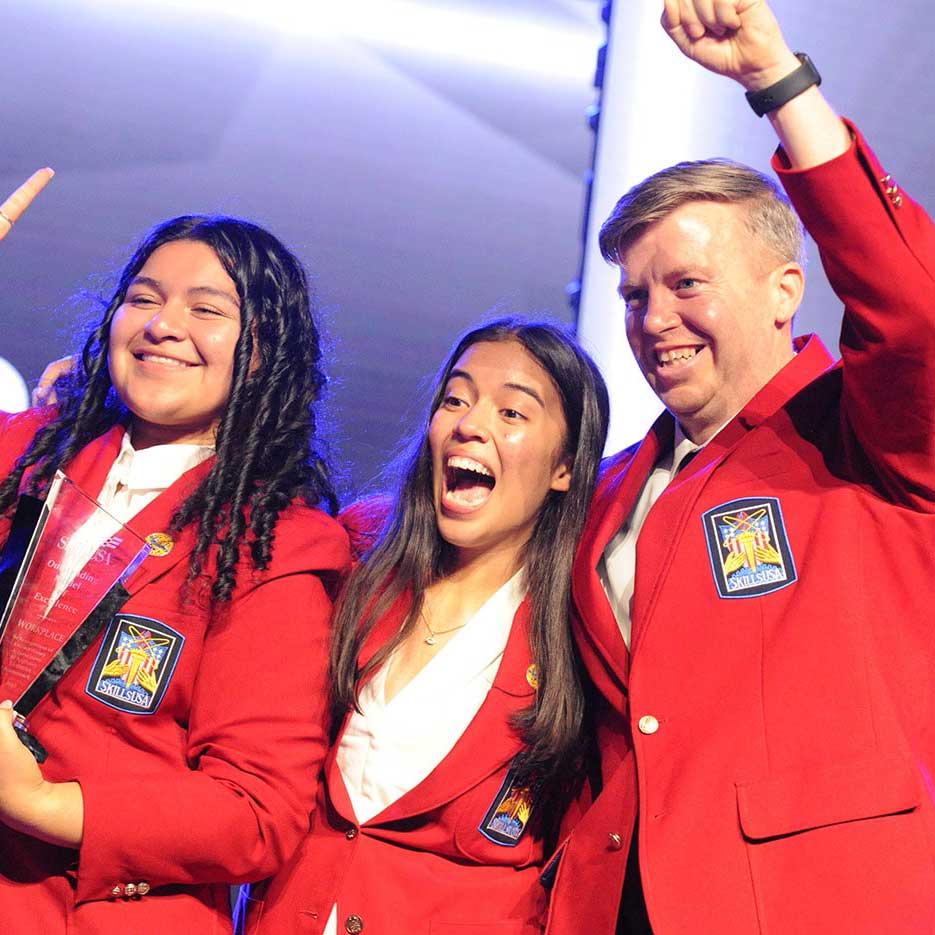 Students and Advisor celebrating Chapter of Excellence win.