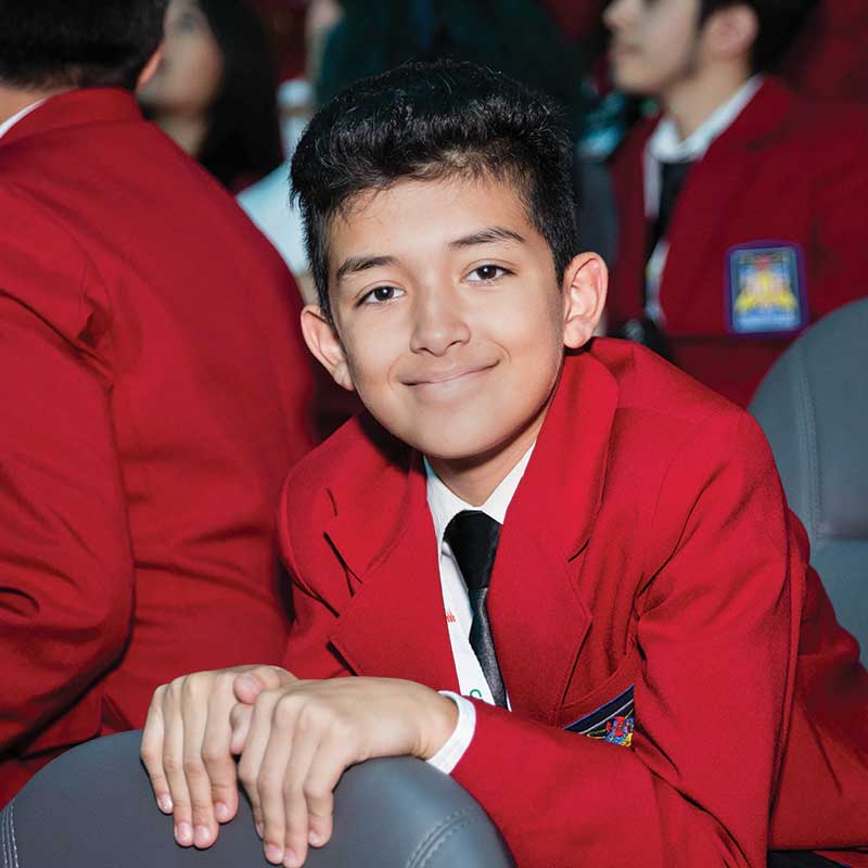 Smiling male student wearing SkillsUSA official attire